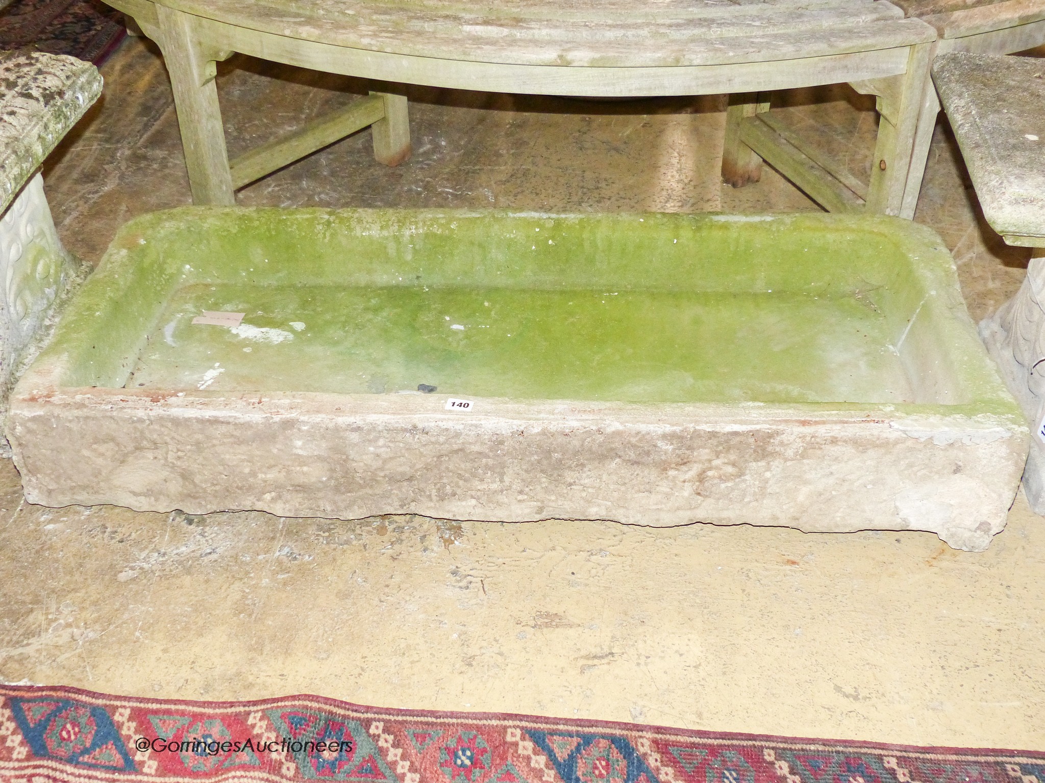 A large stone sink, width 120cm, depth 53cm, height 18cm